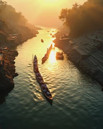 Drone view of a wedding procession on a riverbank at golden hour