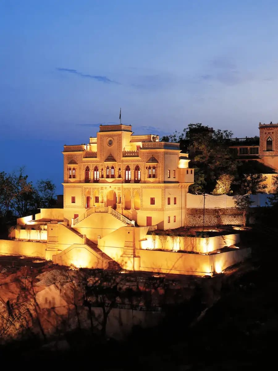 Ananda Himalayan retreat terrace, valley light and cedar forest behind