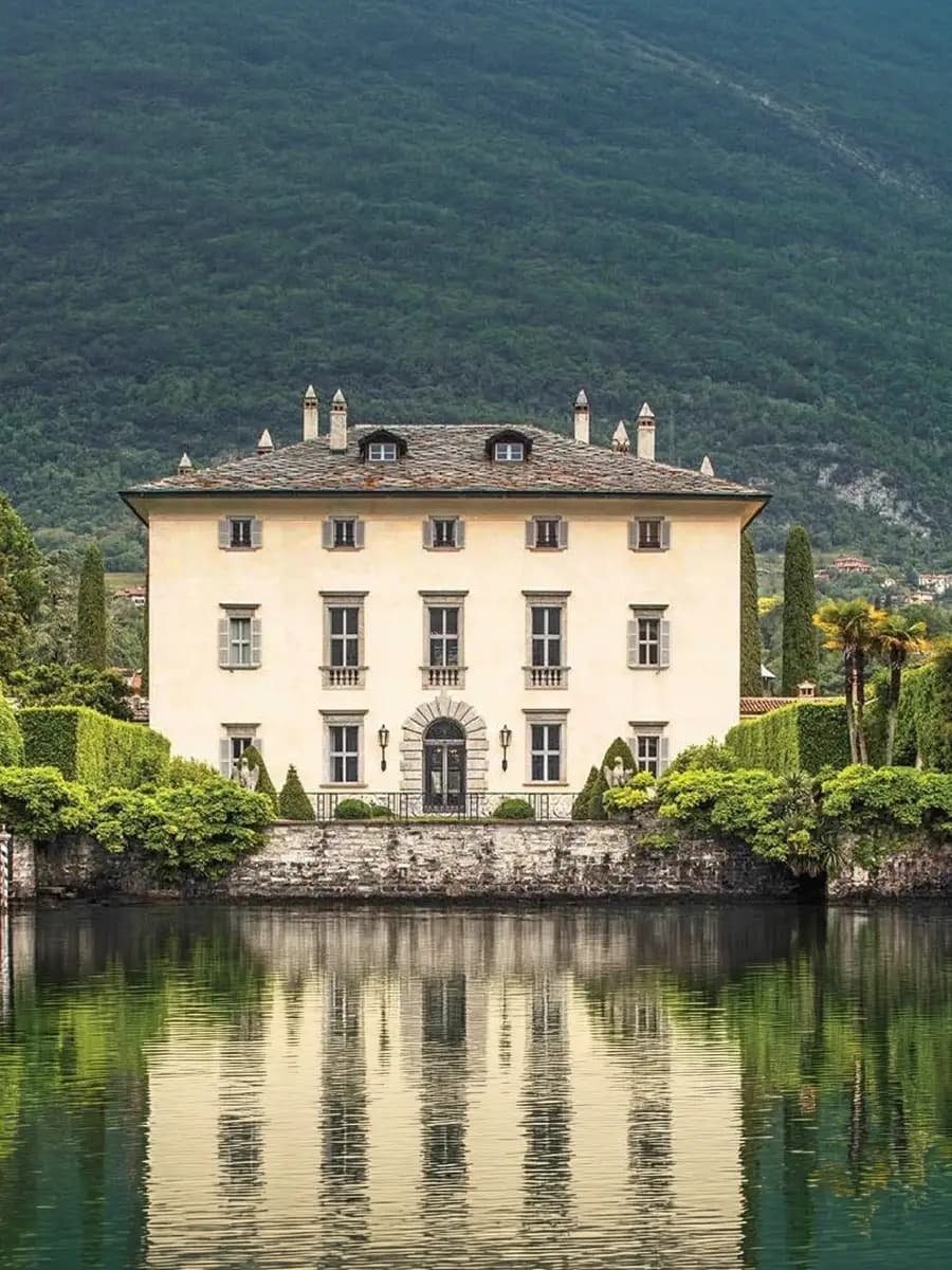 Villa Balbiano lakeside terrace at sunset, cypress and ochre stone