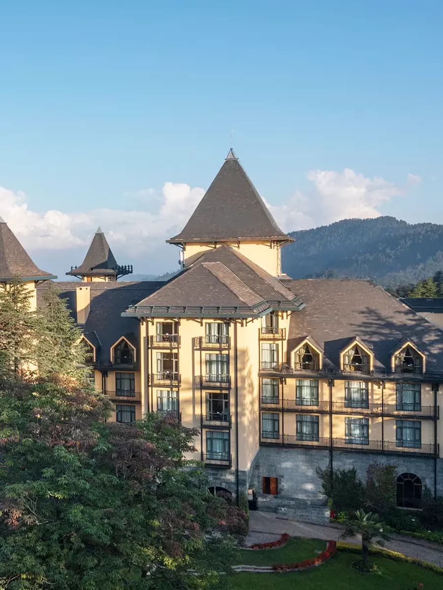 Wildflower Hall colonial terrace at first light, deodars and Himalayan ridge